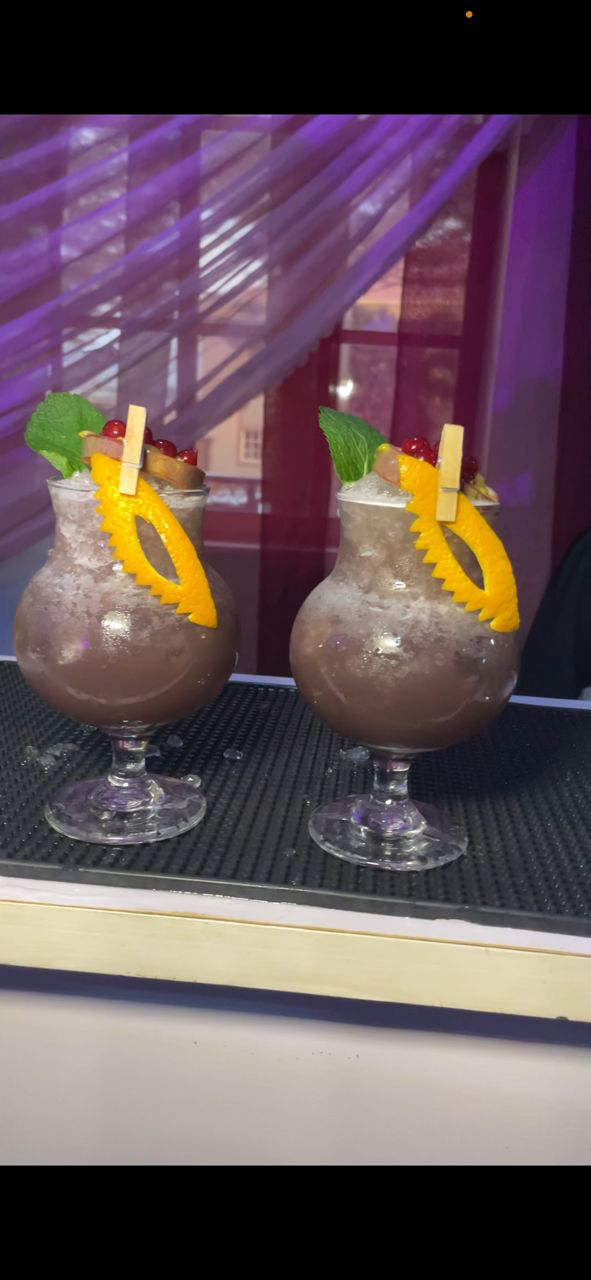 Highbridge Mix signature cocktail with citrus garnish